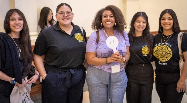 A group of students pose before legislative visits at the Texas Capitol